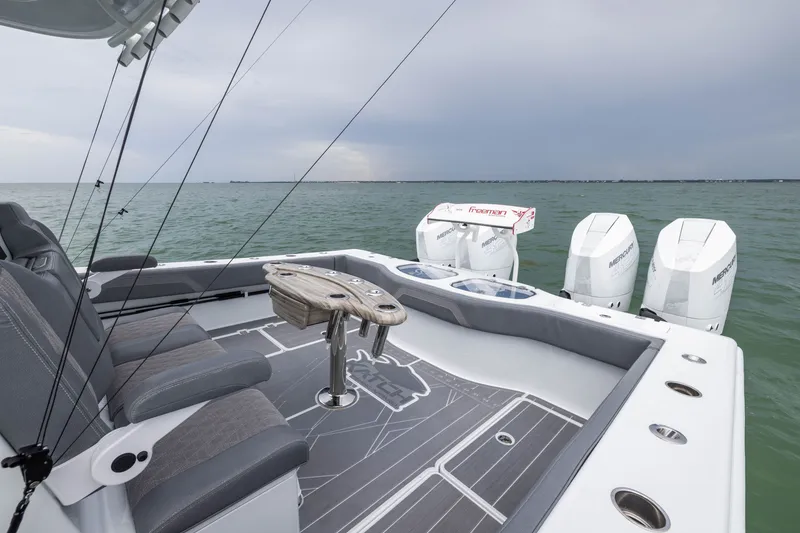Slide: The Image of 2026 Freeman 42LR boat with seating and outboard motors on open water. - 50