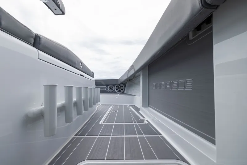 Slide: The Image of Interior view of 2026 Freeman 42LR boat, featuring sleek seating and rod holders. - 26