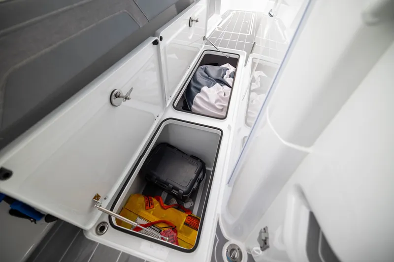 Slide: The Image of Storage compartments on a 2026 Freeman 42LR boat, featuring organized gear and equipment. - 38
