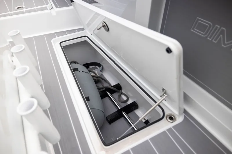 Slide: The Image of Open storage compartment on Freeman 42LR boat, showcasing equipment and sleek design, 2026 model. - 18