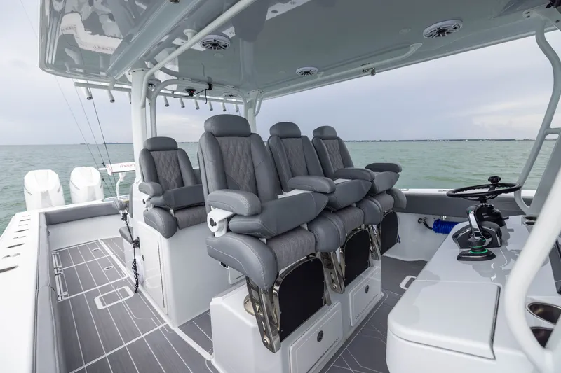 Slide: The Image of Luxury seating on a 2026 Freeman 42LR boat, featuring modern design and ocean backdrop. - 29
