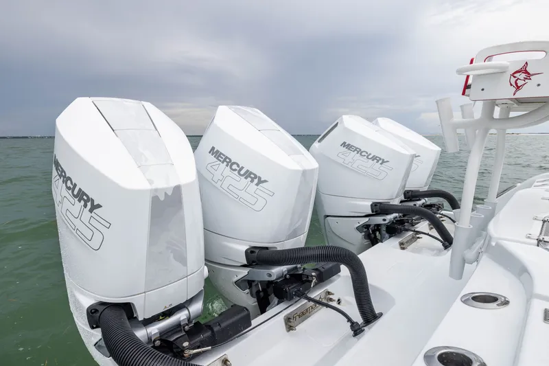 Slide: The Image of Freeman 42LR 2026 boat with triple Mercury 425 outboard engines on water. - 54