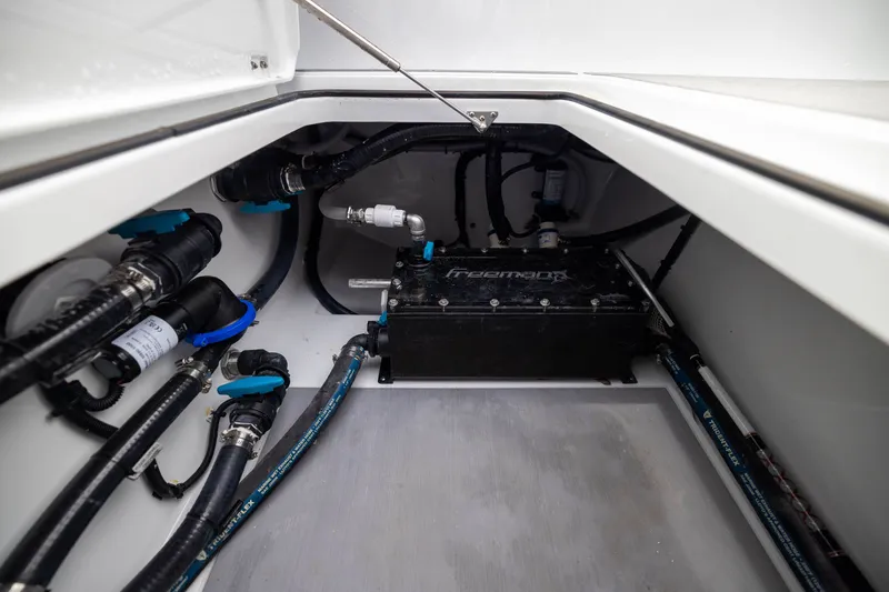 Slide: The Image of Freeman 42LR 2026 boat compartment with plumbing and mechanical components. - 58