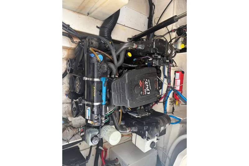 Slide: The Image of Engine compartment of a 2005 Sea Ray Sundancer 260 boat, featuring a MerCruiser motor. - 35