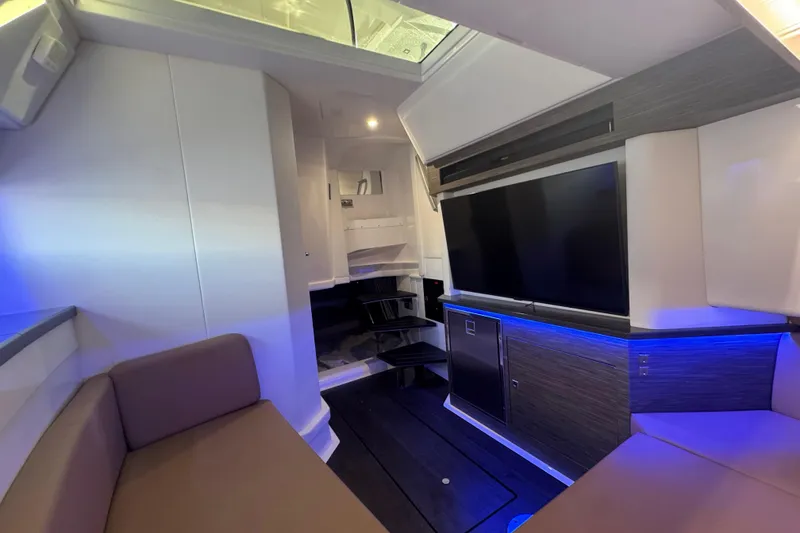 Slide: The Image of Interior of 2022 Aviara AV40 OB boat with modern seating and entertainment system. - 22