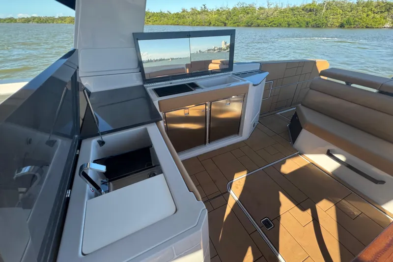 Slide: The Image of Luxury interior of 2022 Aviara AV40 OB boat with modern amenities and scenic water view. - 16