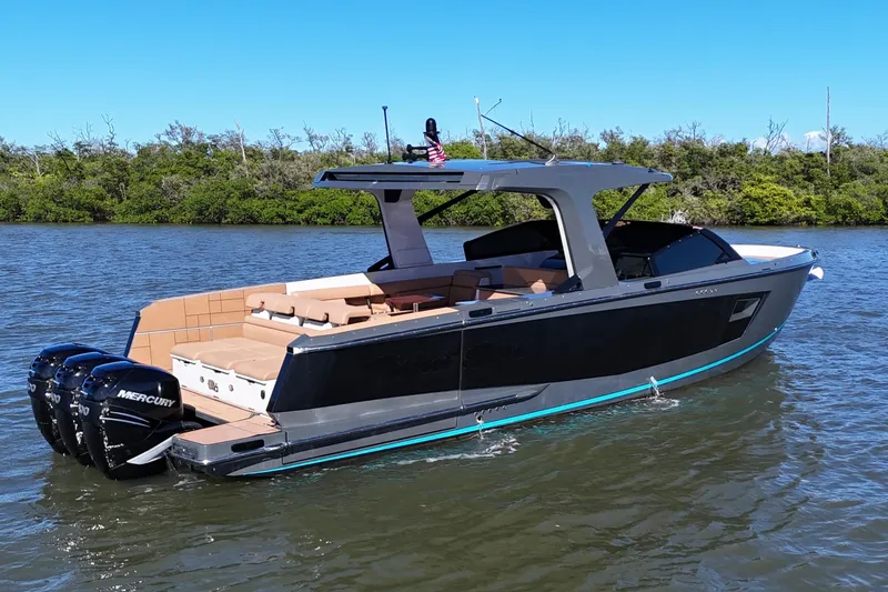 Slide: The Image of 2022 Aviara AV40 OB luxury boat with triple Mercury outboard engines on a calm river. - 3