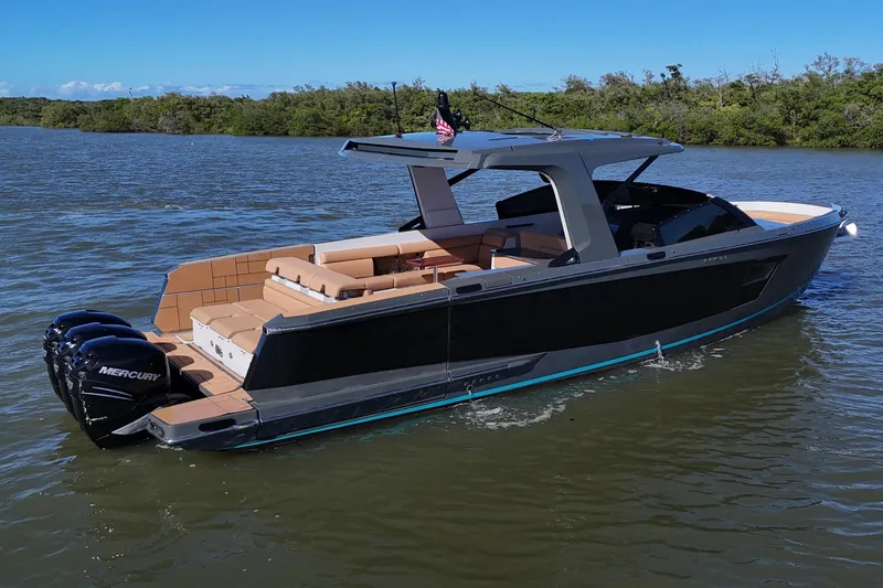Slide: The Image of 2022 Aviara AV40 OB luxury boat on calm water, featuring sleek design and powerful Mercury engines. - 1