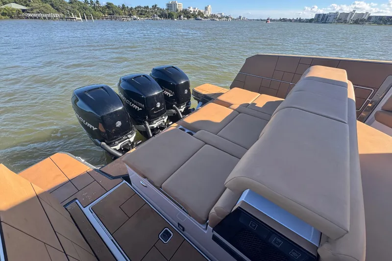 Slide: The Image of 2022 Aviara AV40 OB boat with triple Mercury outboard engines and spacious seating. - 18
