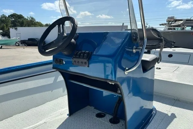 Slide: The Image of 2026 Sea Ark 19 Shadow CC boat console with steering wheel and controls. - 6