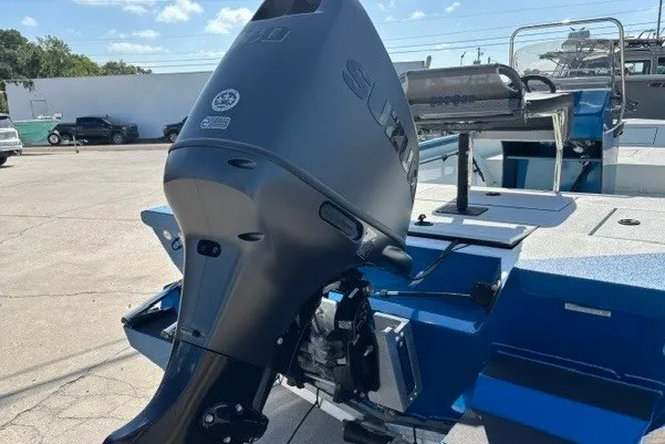 Slide: The Image of 2026 Sea Ark 19 Shadow CC boat with powerful outboard motor in a sunny marina. - 3