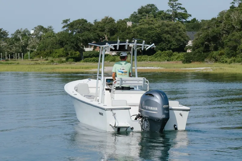 Slide: The Image of 2023 May-Craft 2300 CCX boat with Yamaha engine on calm water. - 12