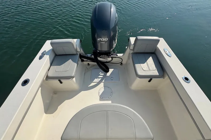 Slide: The Image of 2023 May-Craft 2300 CCX boat with Yamaha 200 engine on calm water. - 8