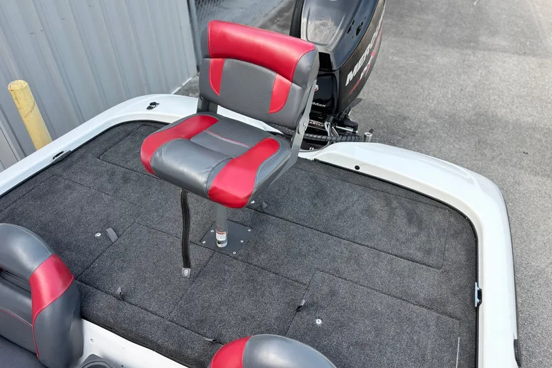 Slide: The Image of 2004 Nitro NX 882 SC boat with red and gray seating, featuring a Mercury outboard motor. - 15