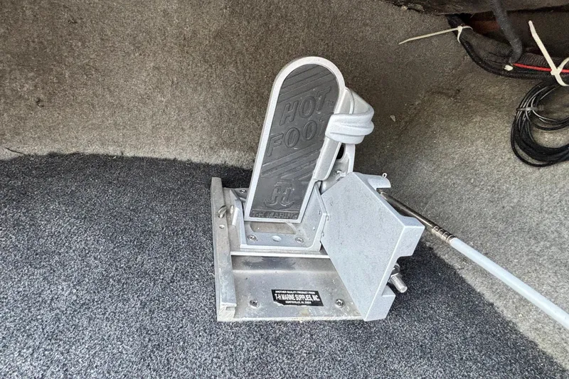 Slide: The Image of Hot Foot throttle pedal in a 2004 Nitro NX 882 SC boat interior. - 13