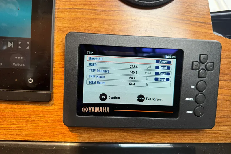 Slide: The Image of Yamaha display on 2024 Cutwater C-248 Coupe showing trip data and fuel usage. - 15