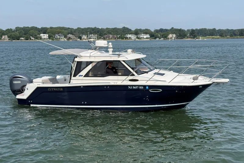 Slide: The Image of 2024 Cutwater C-248 Coupe boat on water, featuring sleek design and Yamaha engine. - 3