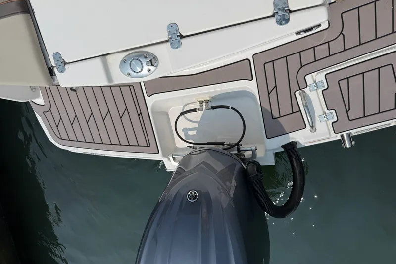 Slide: The Image of 2024 Cutwater C-248 Coupe boat stern with outboard motor and deck details. - 33