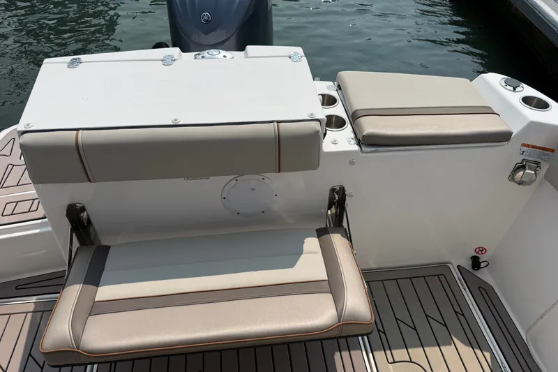Slide: The Image of 2024 Cutwater C-248 Coupe boat seating area with cushioned seats and cup holders. - 31