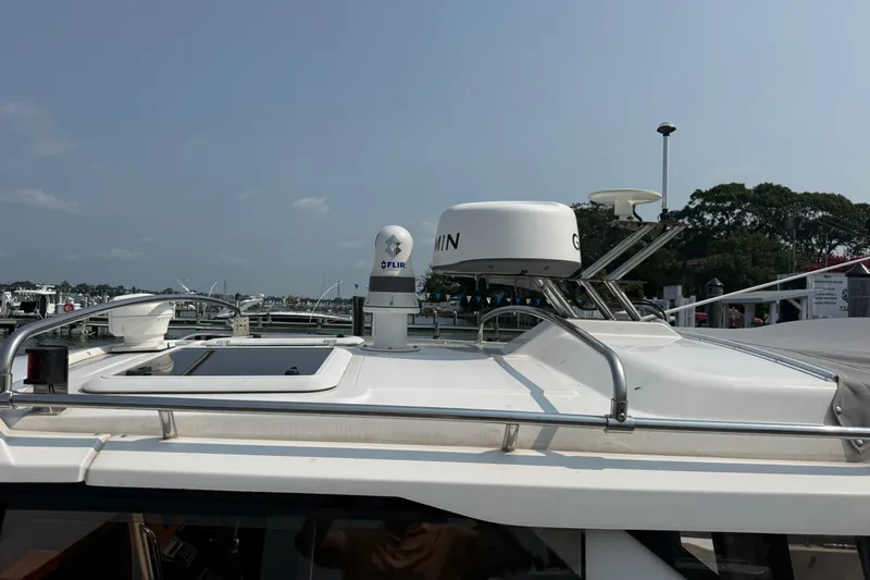 Slide: The Image of 2024 Cutwater C-248 Coupe boat with radar and navigation equipment on deck. - 13