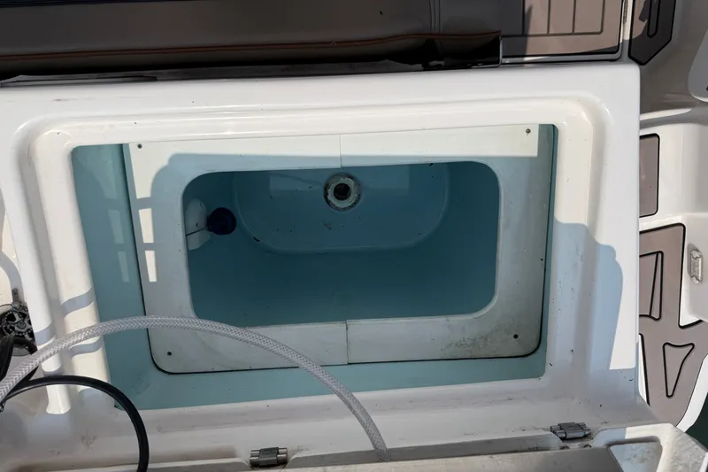 Slide: The Image of 2024 Cutwater C-248 Coupe boat storage compartment, open and empty. - 28