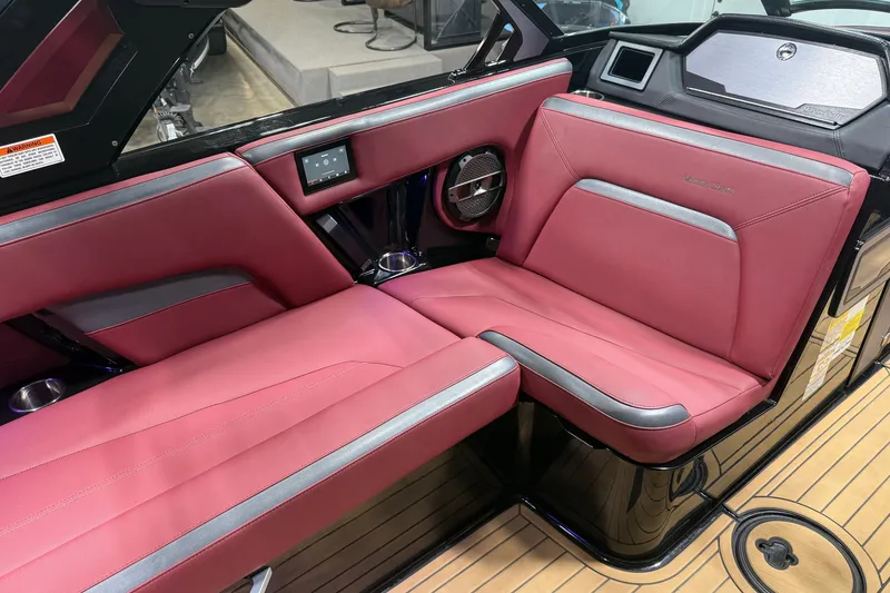 Slide: The Image of 2023 MasterCraft XStar S interior with red seating and modern design elements. - 15