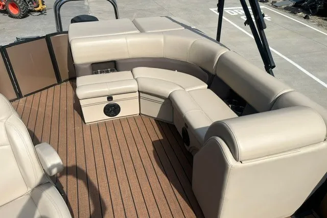 Slide: The Image of 2023 Bentley Pontoons Legacy 243 Cruise interior with beige seating and wood-style flooring. - 8