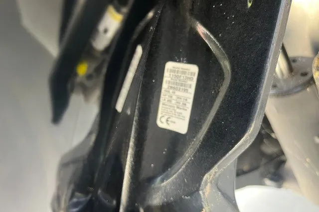 Slide: The Image of 2023 Bentley Pontoons Legacy 243 Cruise engine detail with visible label. - 16