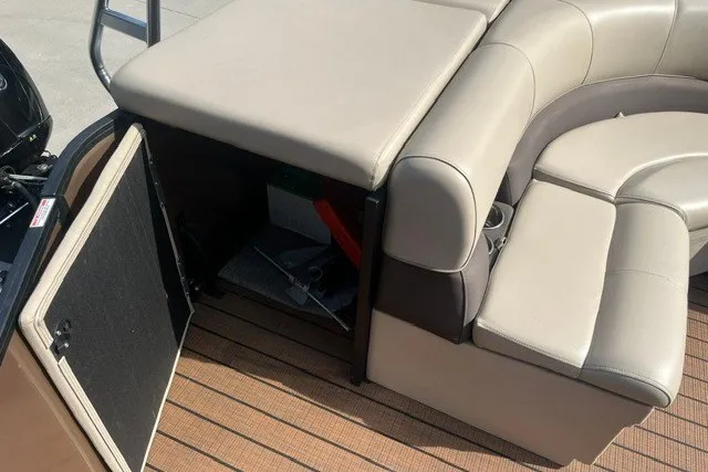 Slide: The Image of 2023 Bentley Pontoons Legacy 243 Cruise interior seating with storage compartment open. - 12