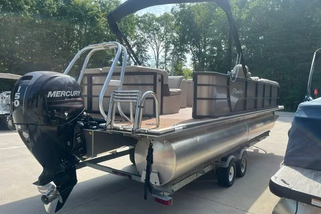 Slide: The Image of 2023 Bentley Pontoons Legacy 243 Cruise with Mercury outboard motor on trailer. - 4