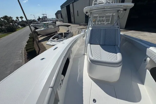 Slide: The Image of 2020 Front Runner 39 Center Console boat docked at a marina. - 9