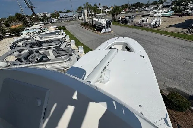 Slide: The Image of 2020 Front Runner 39 Center Console boat in a marina, surrounded by other vessels. - 27