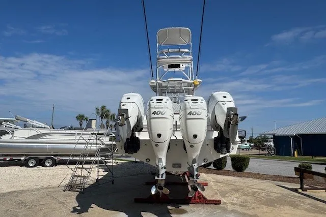 Slide: The Image of 2020 Front Runner 39 Center Console boat with triple 400 horsepower engines, docked outdoors. - 5