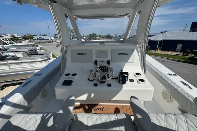 Slide: The Image of 2020 Front Runner 39 Center Console boat cockpit with Simrad navigation system. - 20