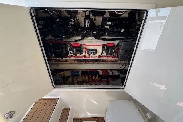 Slide: The Image of Electrical compartment of a 2020 Front Runner 39 Center Console boat, showcasing wiring and components. - 23