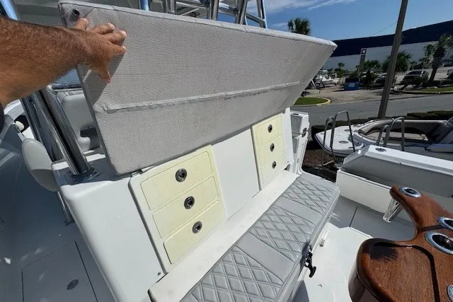 Slide: The Image of 2020 Front Runner 39 Center Console boat interior with storage compartments and seating. - 15