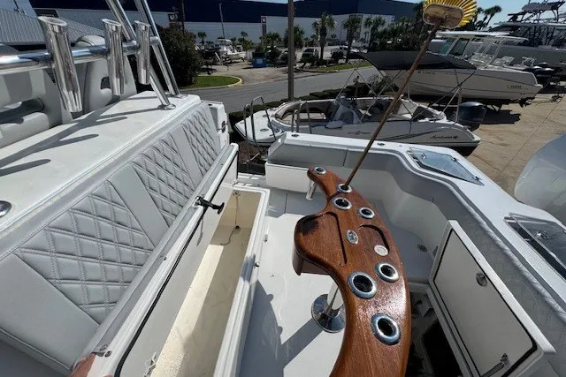 Slide: The Image of 2020 Front Runner 39 Center Console boat with luxurious seating and fishing rod holders. - 14
