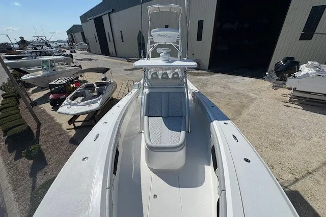 Slide: The Image of 2020 Front Runner 39 Center Console boat docked at a marina. - 6