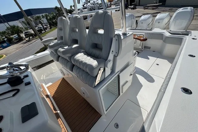 Slide: The Image of 2020 Front Runner 39 Center Console boat interior with cushioned seating and helm controls. - 12