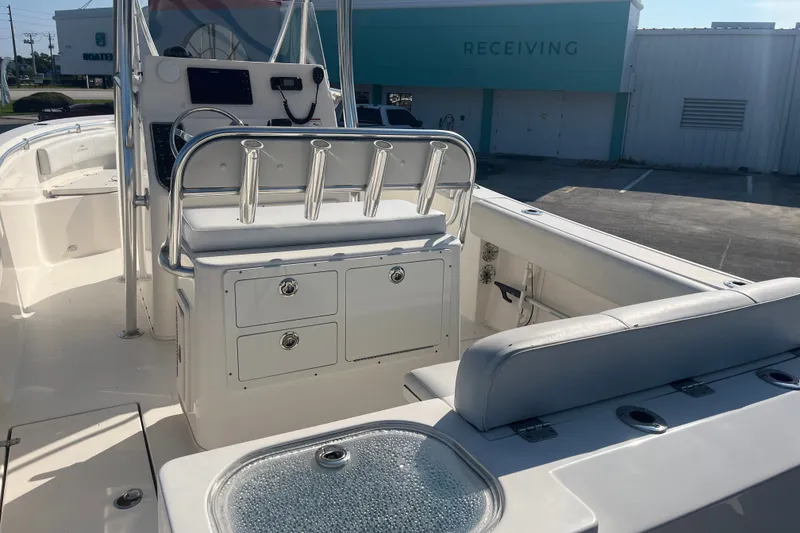 Slide: The Image of 2024 Cobia 237 Center Console boat interior with seating and storage compartments. - 13