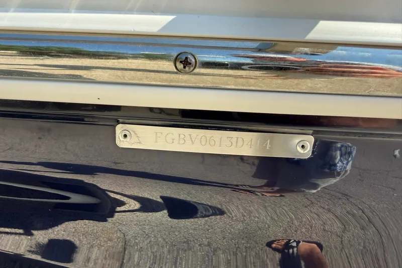 Slide: The Image of 2014 Chaparral 19 Sport H2O boat hull identification number plate. - 15