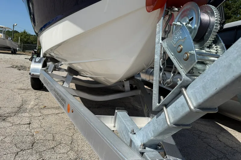 Slide: The Image of 2014 Chaparral 19 Sport H2O boat on trailer, close-up view of hull and winch. - 14