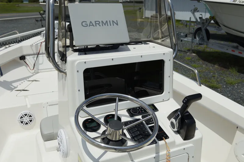 Slide: The Image of 2023 May-Craft 1900CC boat console with Garmin navigation system and steering wheel. - 7