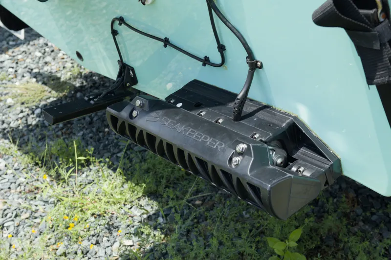 Slide: The Image of 2023 May-Craft 1900CC boat with Seakeeper stabilizer on gravel surface. - 6