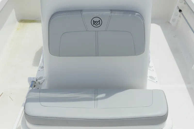 Slide: The Image of 2023 May-Craft 1900CC boat seat with gray upholstery and logo detail. - 10
