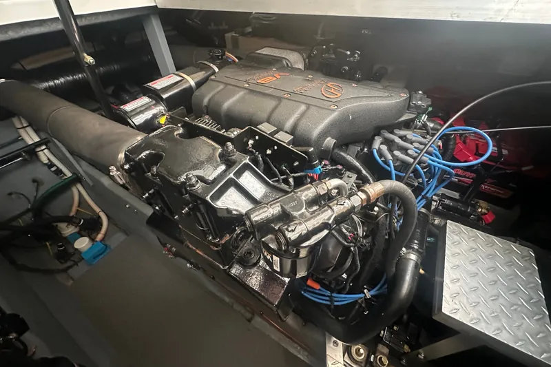 Slide: The Image of Engine compartment of a 1999 Sea Ray Sundancer 370 boat, showcasing detailed mechanics. - 30