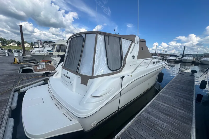 Slide: The Image of 1999 Sea Ray Sundancer 370 docked at marina under blue sky. - 3