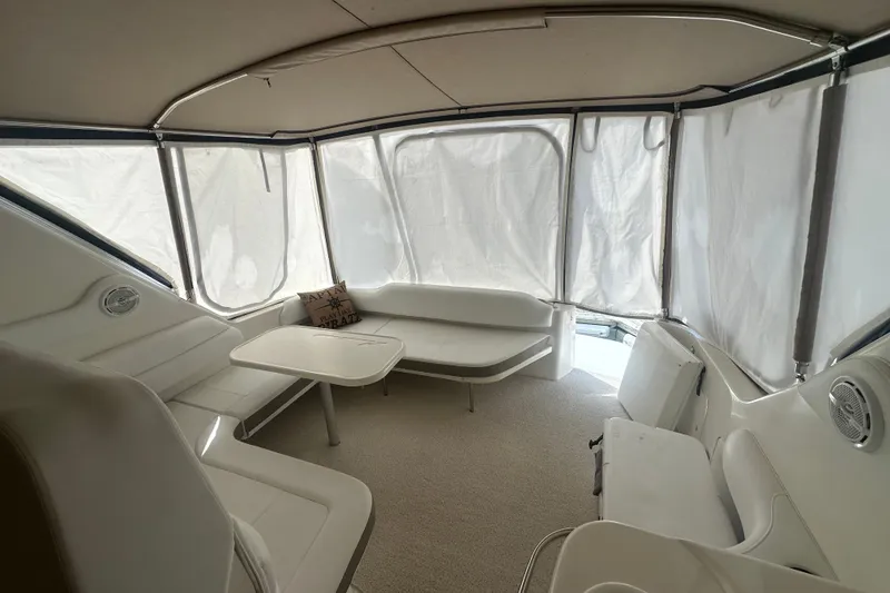 Slide: The Image of Interior of 1999 Sea Ray Sundancer 370 yacht with seating and table. - 12