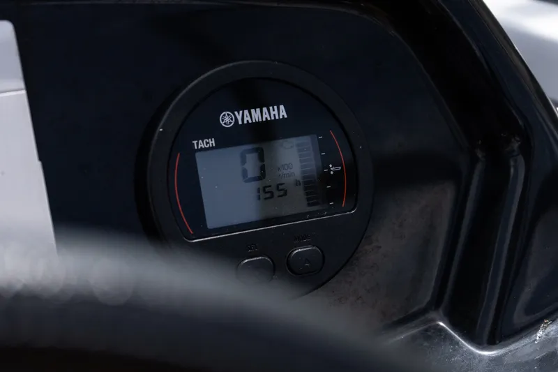Slide: The Image of Yamaha tachometer on 2023 Glastron GX 210 boat dashboard, displaying zero RPM. - 17