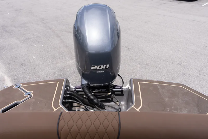 Slide: The Image of 2023 Glastron GX 210 boat with Yamaha 200 outboard motor, rear view. - 16